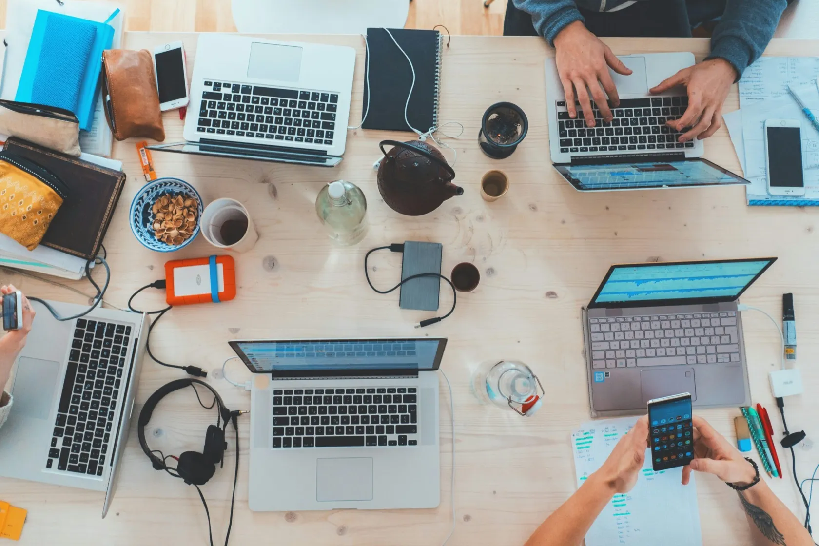 Desks with laptops seen from above